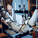 A researcher handles the mastodon tusk in a lab.